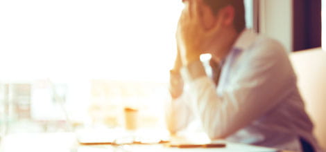 Stressed doctor at desk
